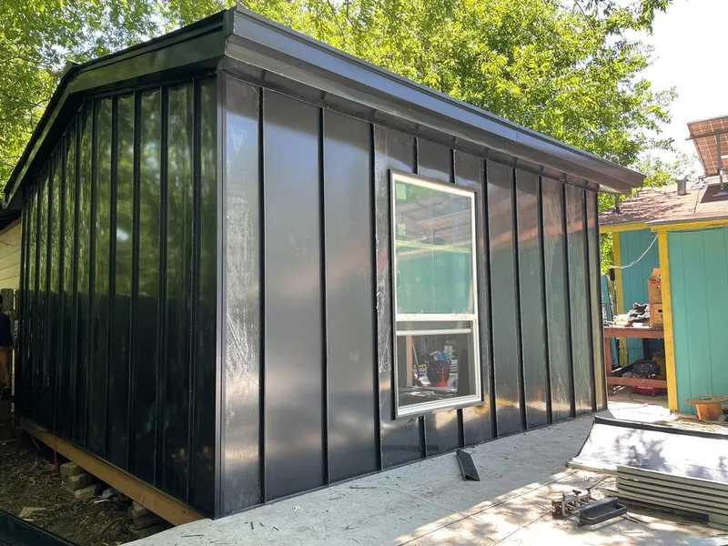 Black standing seam metal wall panels for Metal Roof Installation in San Leon