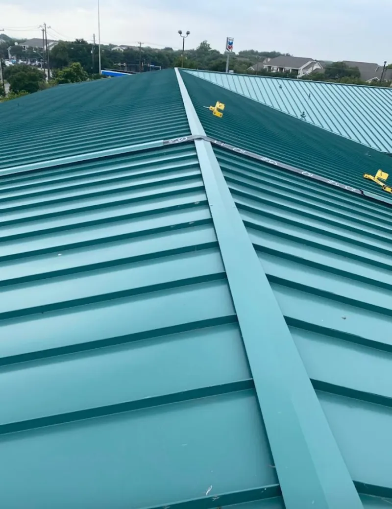 Green commercial metal roof ridge and valley for Metal Roof Repair in San Leon