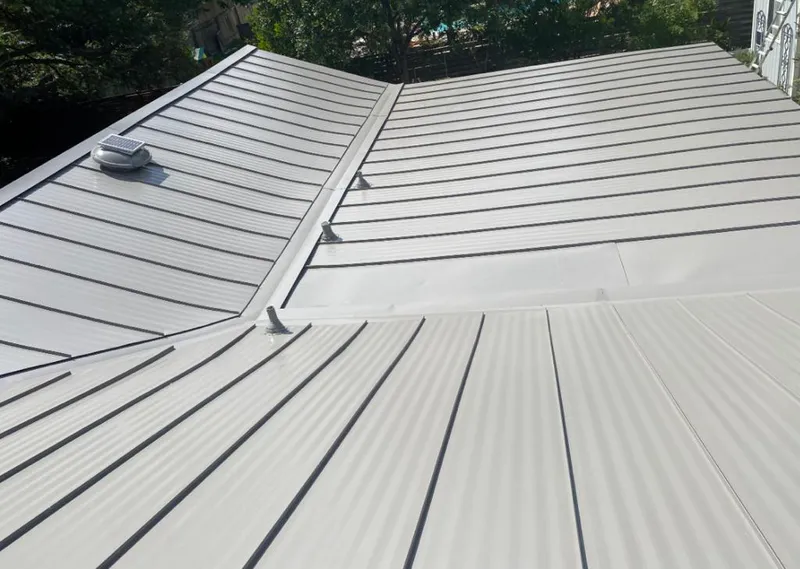 Solar attic fan installed on a metal roof for Roof Ventilation in San Leon